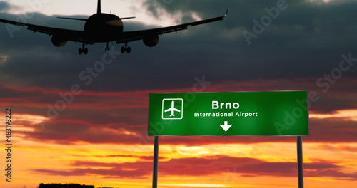Plane landing in Brno Czech airport with signboard