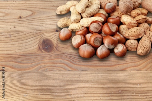 Roasted chestnuts, autumn food on a rustic wooden background