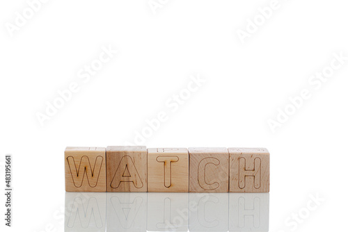 Wooden cubes with letters watch on a white background