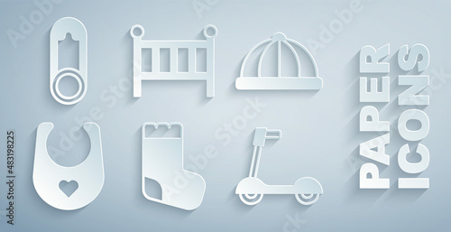 Set Baby socks, hat, bib, Roller scooter, crib cradle bed and clothes pin icon. Vector