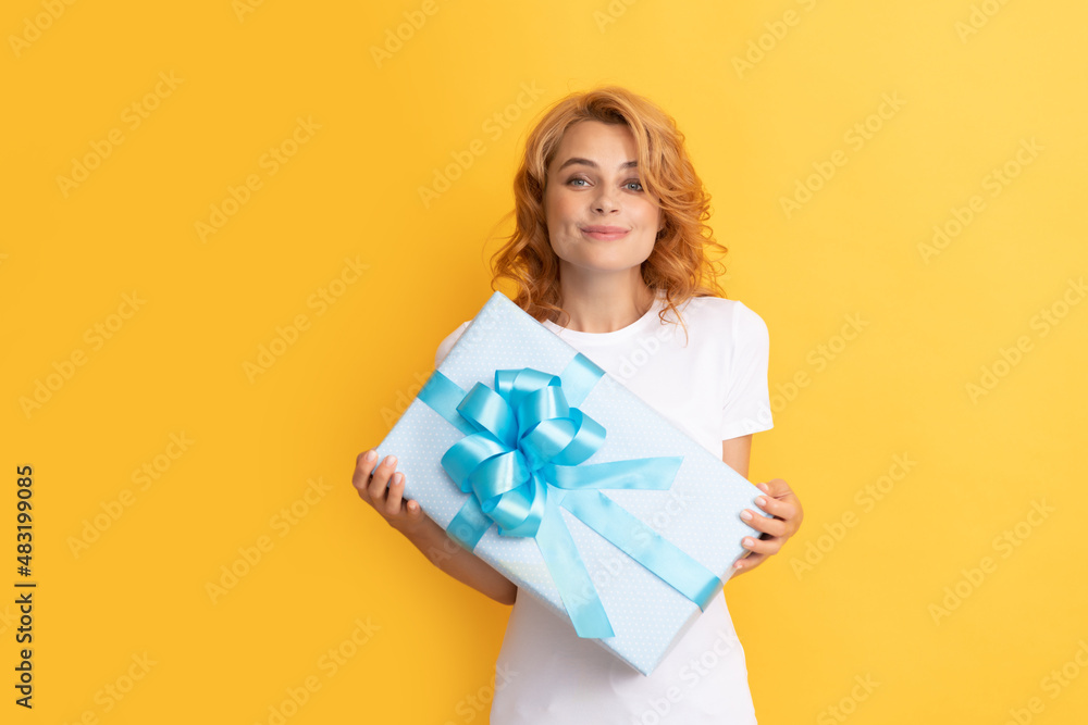 smiling redhead lady with giftbox. mothers day smiling redhead lady with giftbox. mothers day