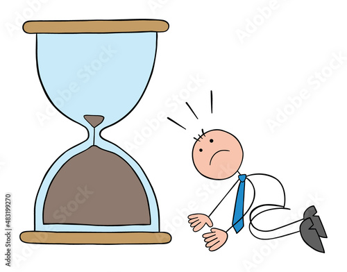 Stickman businessman is on his knees and devastated before the great hourglass, which is about to end, he could not complete the task on time