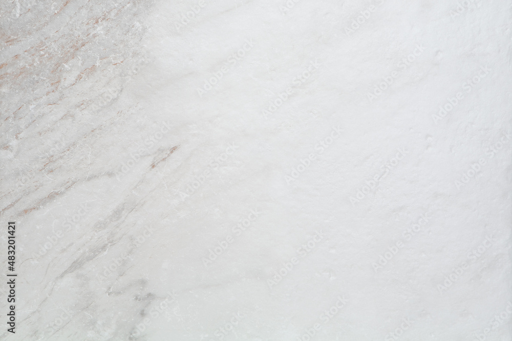 Fototapeta premium Empty white and grey marble flat lay background. Smooth stone backdrop with no people and no props.