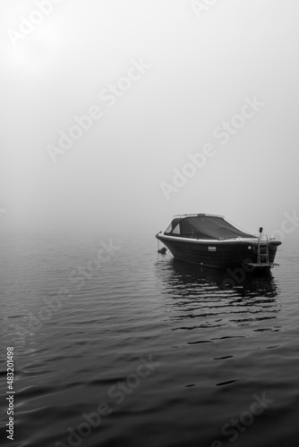 sloop on the lake at morning fog	
