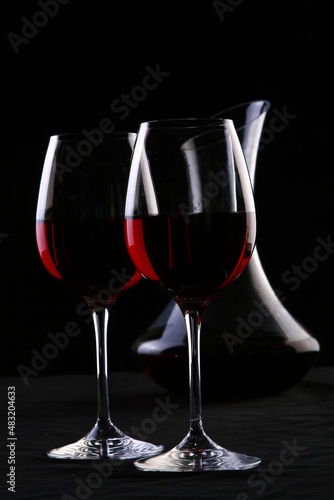 glass of wine on black background