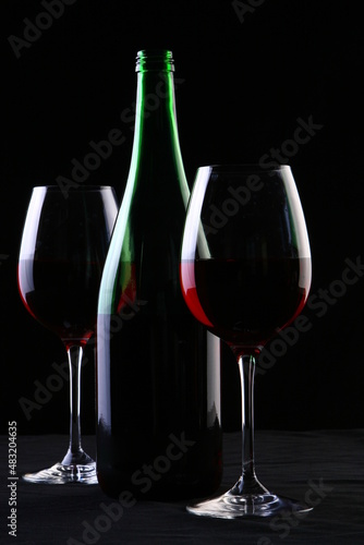 glass of wine on black background