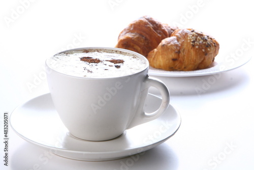 fresh croissant with black coffee