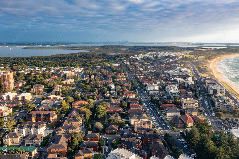 Fototapeta premium Panoramic aerial drone view of Cronulla in the Sutherland Shire, South Sydney, looking toward North Cronulla Beach during summer in the early morning 