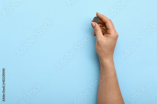Woman holding lithium butto...