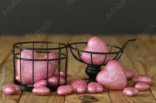 concept about let be your love freedom. Black cage open with bunch of pink hearts around.