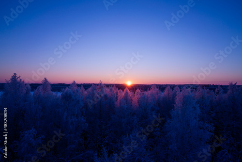 Winter sunset in Torronsuo horizon Finland
