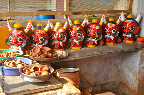 beautiful view of the stacked Drishti dolls (evil defender). Evil eye doll. clay carving. This Drishti bommai is used for preventing your house from any sort of bad things. photo