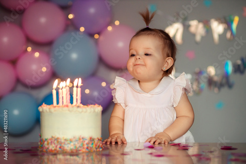 Happy one year old baby with birthday cake. Children's birthday