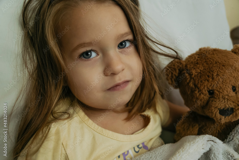 Portrait of sad sick little girl looking to the camera. Portrait of sad sick little girl looking to the camera.