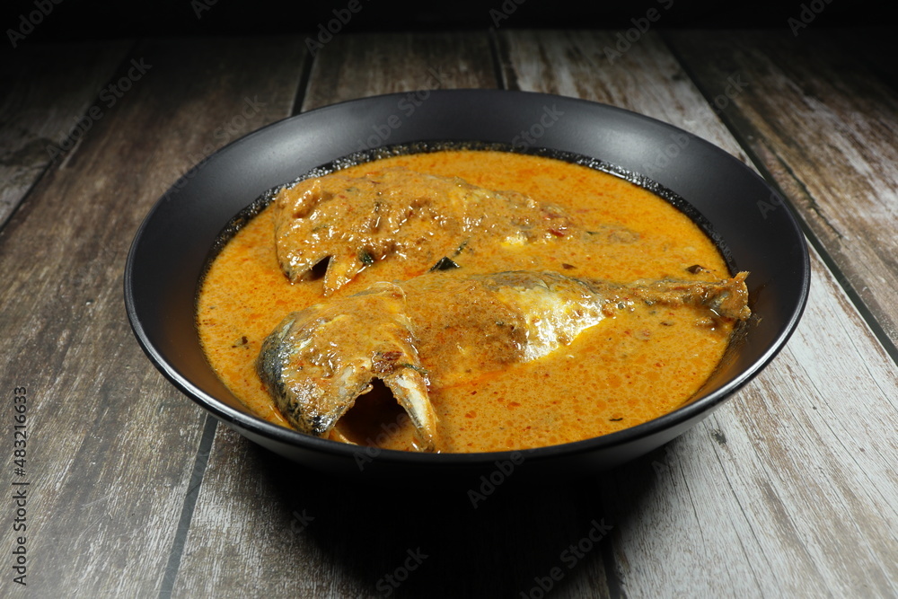 Traditional red curry soup of mackerel fish with coconut milk and curry paste serving in the bowl. Famous spicy seafood menu in Asia restaurant. Traditional red curry soup of mackerel fish with coconut milk and curry paste serving in the bowl. Famous spicy seafood menu in Asia restaurant.