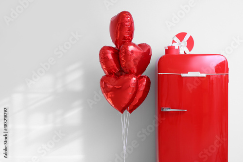 Gift boxes on red refrigera...
