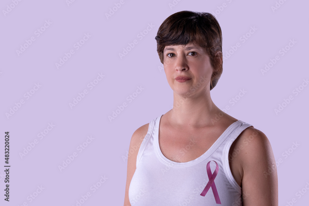 Woman with pink ribbon fighting against cancer. Woman with pink ribbon fighting against cancer.