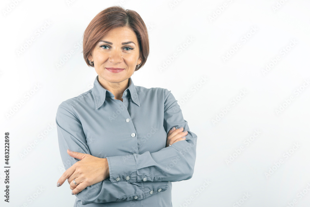 Beautiful young business woman in a suit thinks over her project on a white background Beautiful young business woman in a suit thinks over her project on a white background