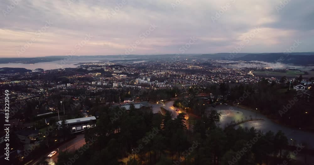 Aerial View Of Oslo City And Inner Oslofjord From Holmenkollen Mountain In Norway At Dusk. Aerial View Of Oslo City And Inner Oslofjord From Holmenkollen Mountain In Norway At Dusk.
