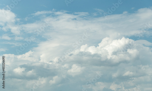 Fototapeta Naklejka Na Ścianę i Meble -  Cumuliform cloudscape on sky. Panorama. The sun is hidden.  Cumulonimbus clouds.