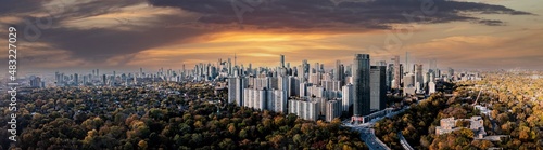 Photography Drone Panorama of Toronto skyline with trees surrounding the cityscape	 sun set