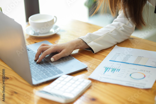 Cropped image of a businesswoman working on digital laptop