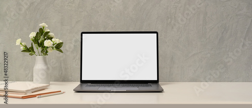 Simple minimal workspace with laptop blank screen mockup