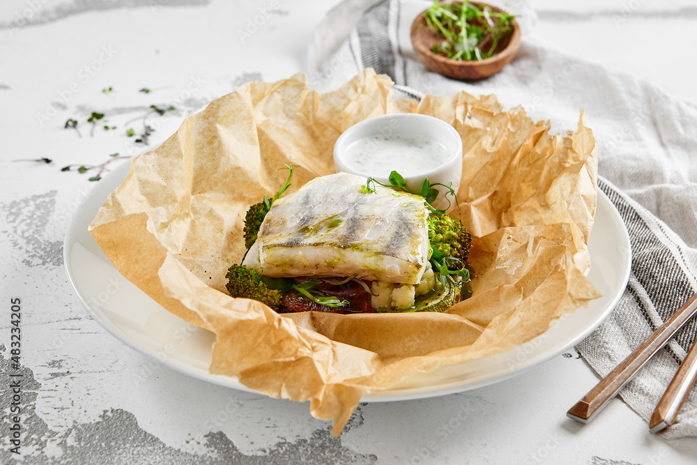 White fish fillet with broccoli in rustic style. Healthy eating: cooked fish fillet with vegetables garnish. Diet food with whitefish and broccoli. Steam vegetables with roasted zander fillet. White fish fillet with broccoli in rustic style. Healthy eating: cooked fish fillet with vegetables garnish. Diet food with whitefish and broccoli. Steam vegetables with roasted zander fillet.