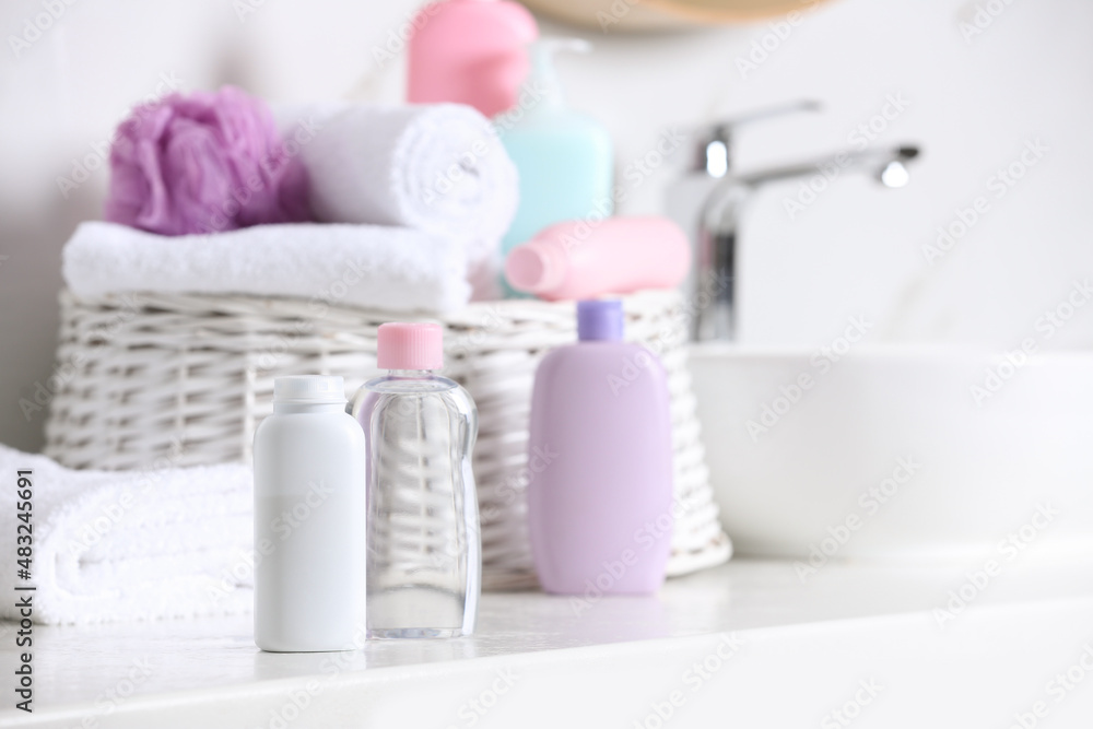 Baby cosmetic products on white table, space for text Baby cosmetic products on white table, space for text