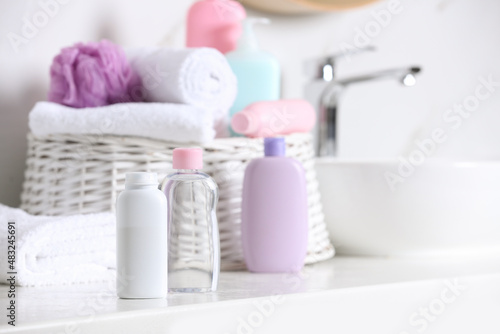 Baby cosmetic products on white table, space for text
