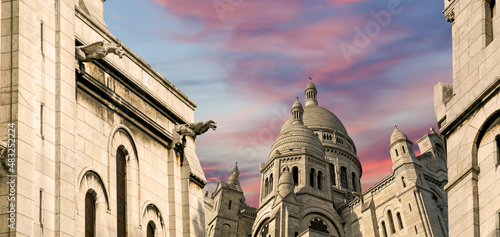 Basilica of the Sacred Heart of Paris, commonly known as Sacre-Coeur Basilica, located in the Montmartre district of Paris, France photo