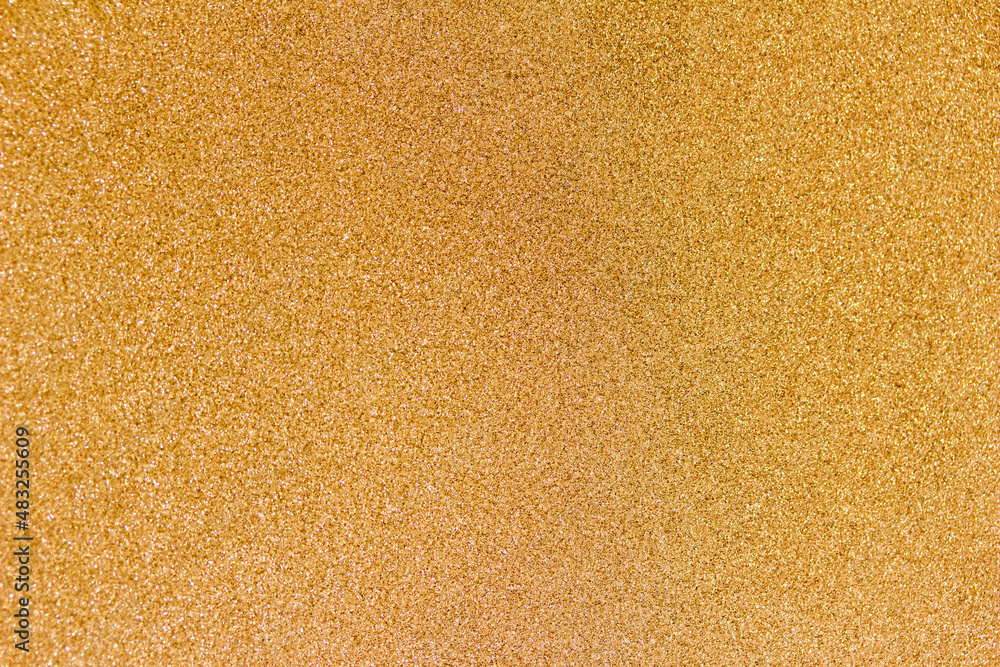 Full frame macro abstract texture background of a frosted glass window pane with natural ice crystals colorized in a golden hue Full frame macro abstract texture background of a frosted glass window pane with natural ice crystals colorized in a golden hue
