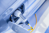 electricity car or EV car plug in power charging at power station future driving concept