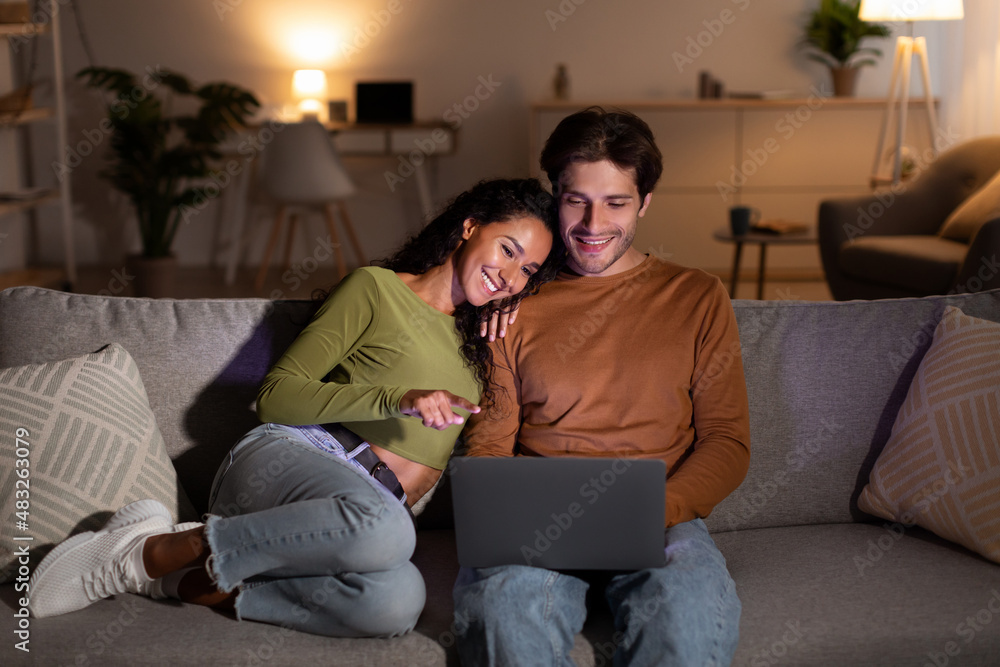 Relaxed Spouses Enjoying Movie Online On Laptop Relaxing At Home Relaxed Spouses Enjoying Movie Online On Laptop Relaxing At Home