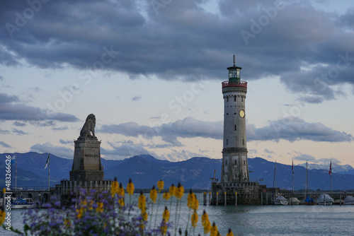 Lighthouse and lion statue in Lindau with sunset, Germany
