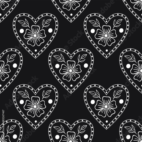 Folk flowers heart. Seamless pattern on the black background.