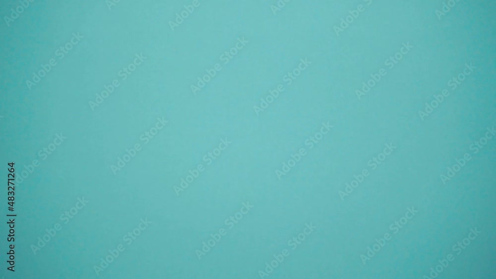 Close-up businesswoman's hand passes dollars on a blue background. Cash for exchange, investment and savings for the future. Receiving a salary, loan or debt. Buying and selling for cash. Close-up businesswoman's hand passes dollars on a blue background. Cash for exchange, investment and savings for the future. Receiving a salary, loan or debt. Buying and selling for cash.