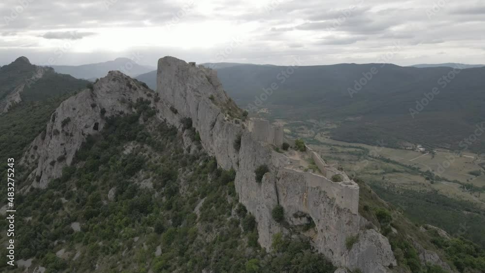 Historic fortress atop steep vertical rock cliff in French Pyrenees Historic fortress atop steep vertical rock cliff in French Pyrenees