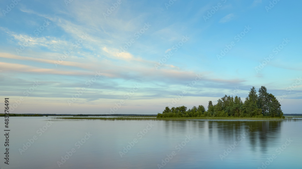 An island on the lake: summer, light calm, clouds, Sestroretsky Razliv.