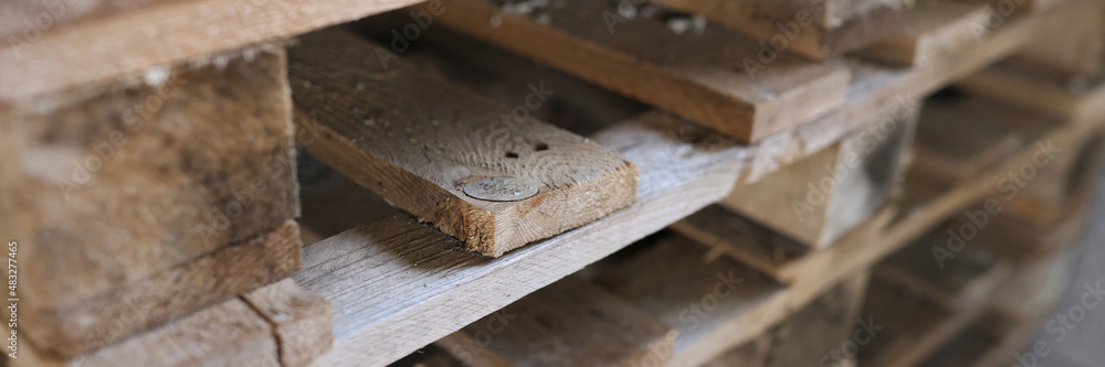 Construction wooden pallets are stacked together closeup Construction wooden pallets are stacked together closeup