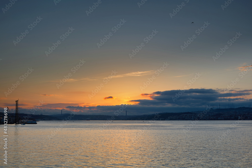 Dawn in the morning over the sea. Seascape with the rising Sun over the Bosphorus. Istanbul, Turkey.