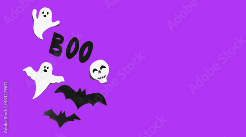 Halloween set decorations with ghost  bat  skeleton and word BOO on yellow background. Holiday party  minimal greeting card  spooky concept. flat lay  copy space  top view  place for text