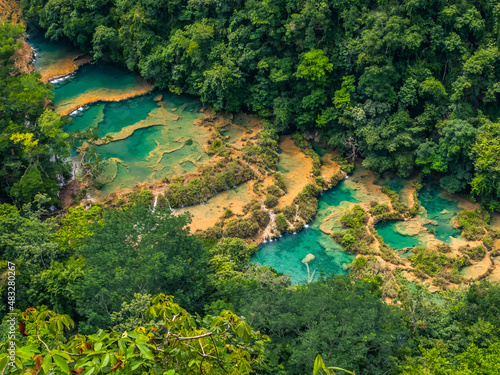 Semuc champey natural bridge of limestone in the cahabon river of Guatemala in the middle of the subtropical jungle photo