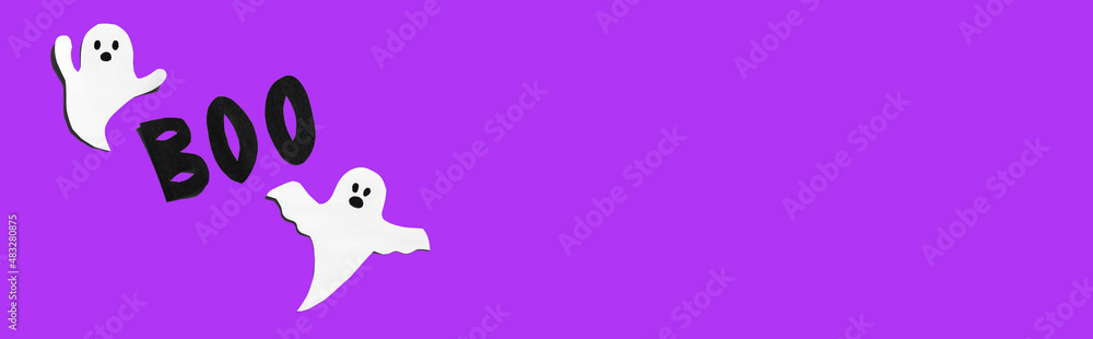 Halloween set decorations with ghost and word BOO on violet very peri background. Holiday party, minimal greeting card, spooky concept. flat lay, copy space, top view, place for text, banner Halloween set decorations with ghost and word BOO on violet very peri background. Holiday party, minimal greeting card, spooky concept. flat lay, copy space, top view, place for text, banner