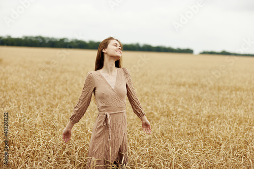 female hand the farmer concerned the ripening of wheat ears in early summer sunny day © SHOTPRIME STUDIO