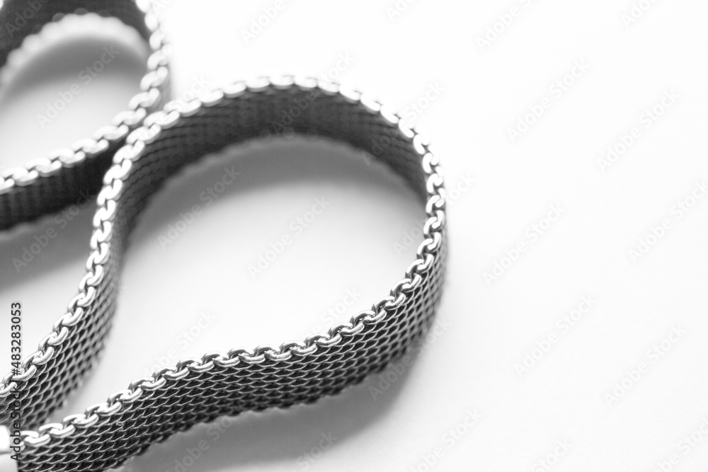Rolled braided silver ribbon bracelet is on white Rolled braided silver ribbon bracelet is on white