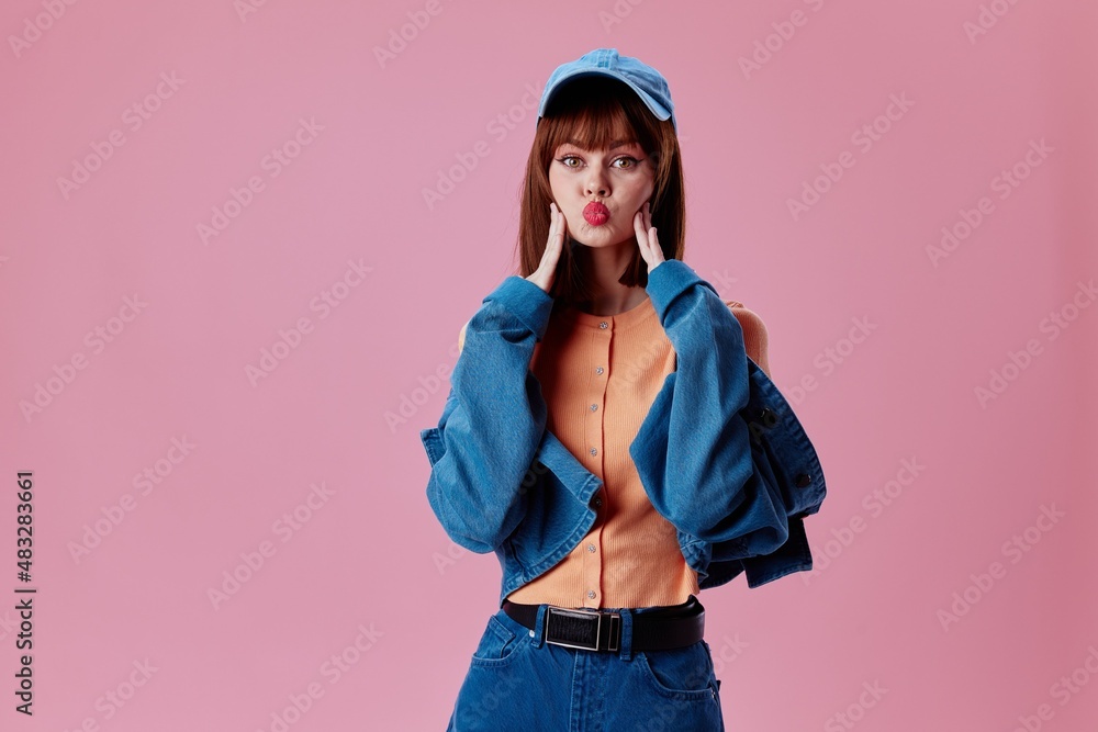 Pretty young female denim clothing fashion posing cap color background unaltered