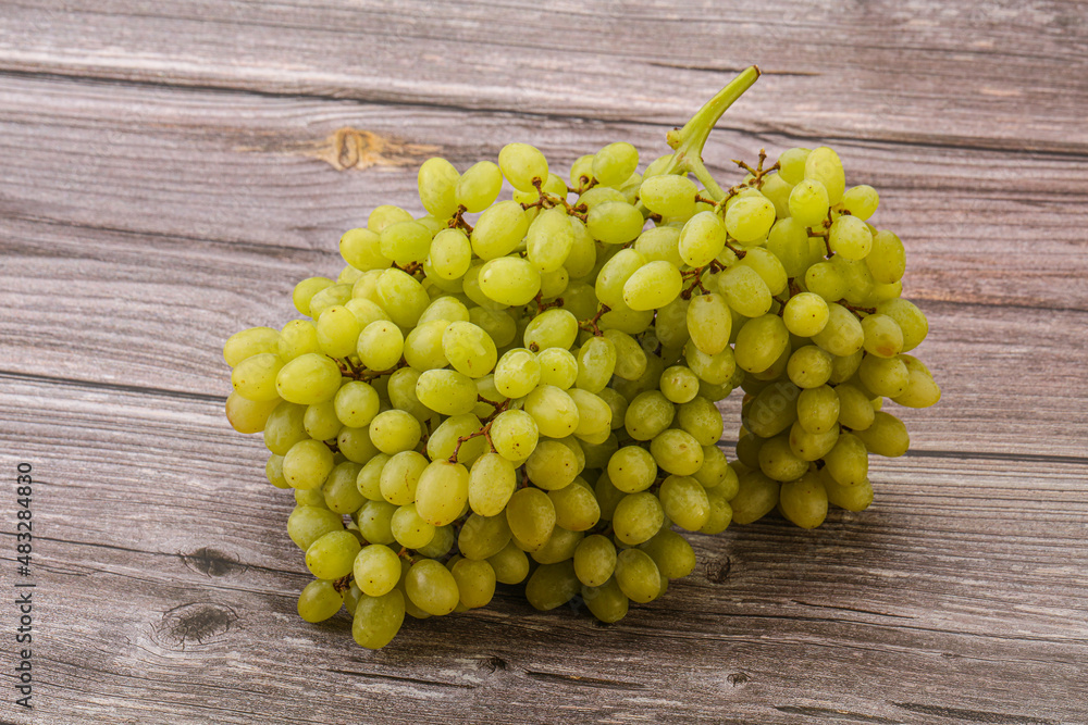 Green grape branch over background Green grape branch over background