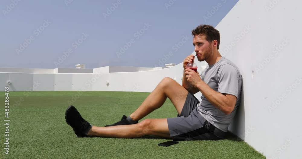 Beet Juice. Fitness sport man relaxing enjoying post workout morning