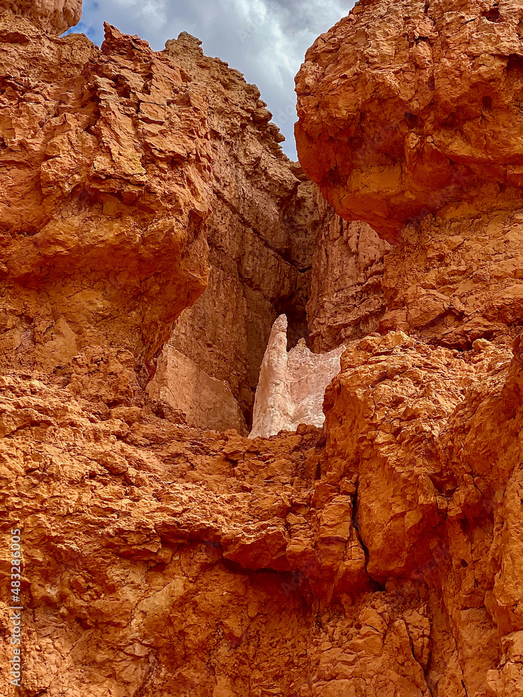 Hiking deep into Bryce Canyon and looking up adds wonderment to the natural beauty surrounding this traveler Hiking deep into Bryce Canyon and looking up adds wonderment to the natural beauty surrounding this traveler